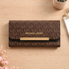 Michael Kors Jet Set Large Logo Trifold Wallet in brown signature PVC leather. Dive deeper in AI Mode