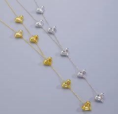 a "Simple Y-shaped Love Heart Shape Tassel Necklace" often marketed for women as a long sweater chain.