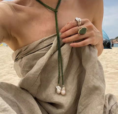 This vintage irregular baroque pearl necklace, specifically the model identified as XL1095-G, features a green beaded chain with drop-shaped