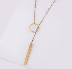 This product appears to be a minimal gold-plated lariat necklace featuring a circle and a vertical bar