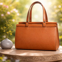 a David Jones brown top-handle handbag, likely made of PU leather.