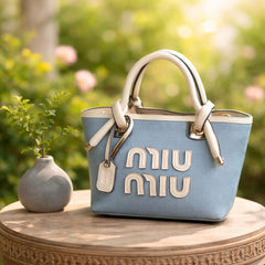Miu Miu Beau top-handle bag in a canvas and leather material combination