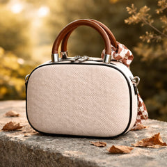 Christian Dior handbag with a top handle and a checkered scarf accessory