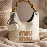Miu Miu Nappa Ivy bag in talco leather.