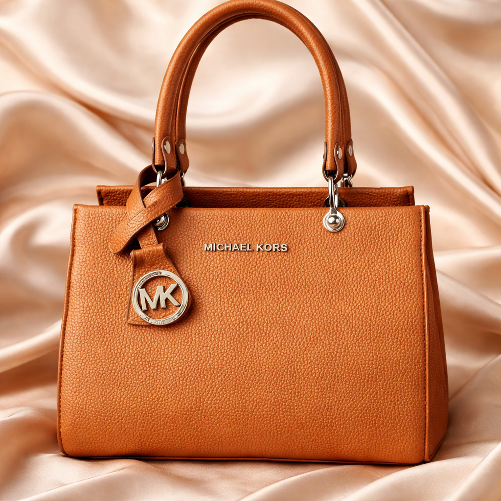 Michael Kors Sutton Medium Leather Satchel handbag in a brown color. 