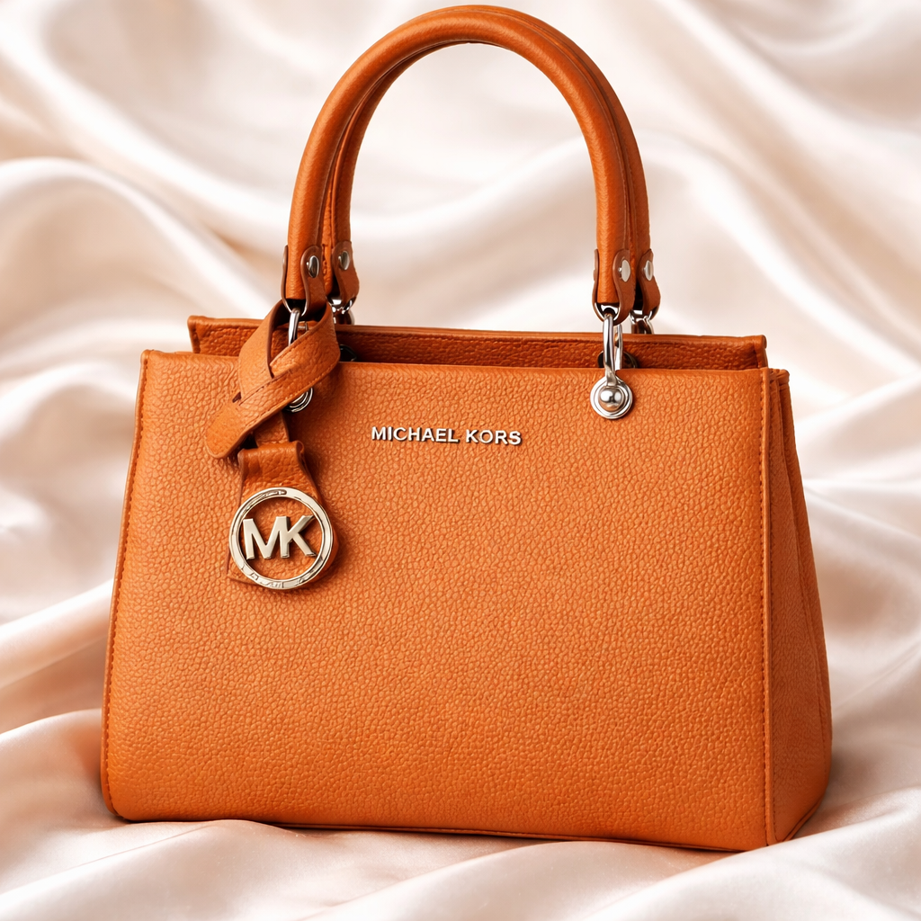 Michael Kors Sutton Medium Leather Satchel handbag in a brown color. 