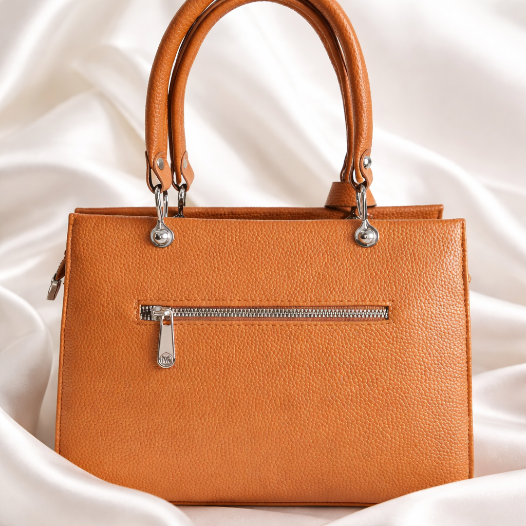 Michael Kors Sutton Medium Leather Satchel handbag in a brown color. 
