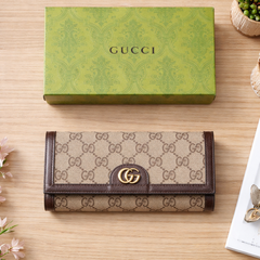 Gucci Ophidia chain wallet in beige and dark brown GG supreme canvas with the gold-toned Double G hardware.