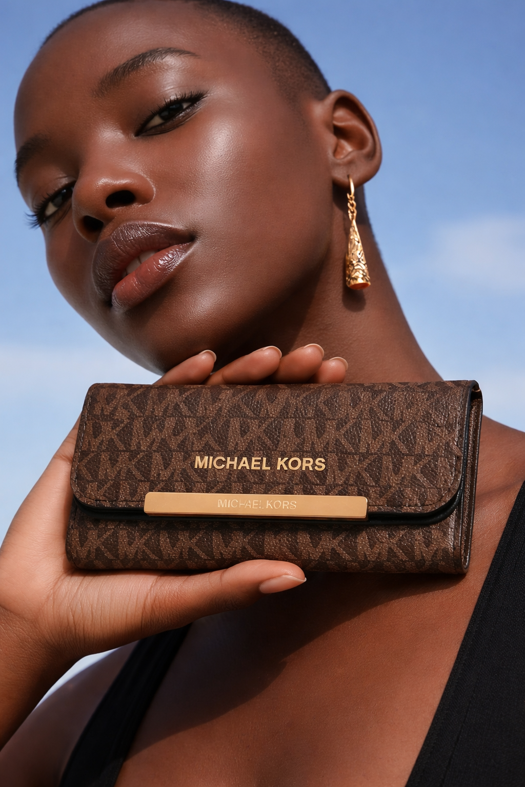 Michael Kors Jet Set Large Logo Trifold Wallet in brown signature PVC leather.  Dive deeper in AI Mode
