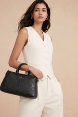 Louis Vuitton Trianon MM bag in black Monogram Empreinte leather.