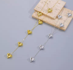 a "Simple Y-shaped Love Heart Shape Tassel Necklace" often marketed for women as a long sweater chain.