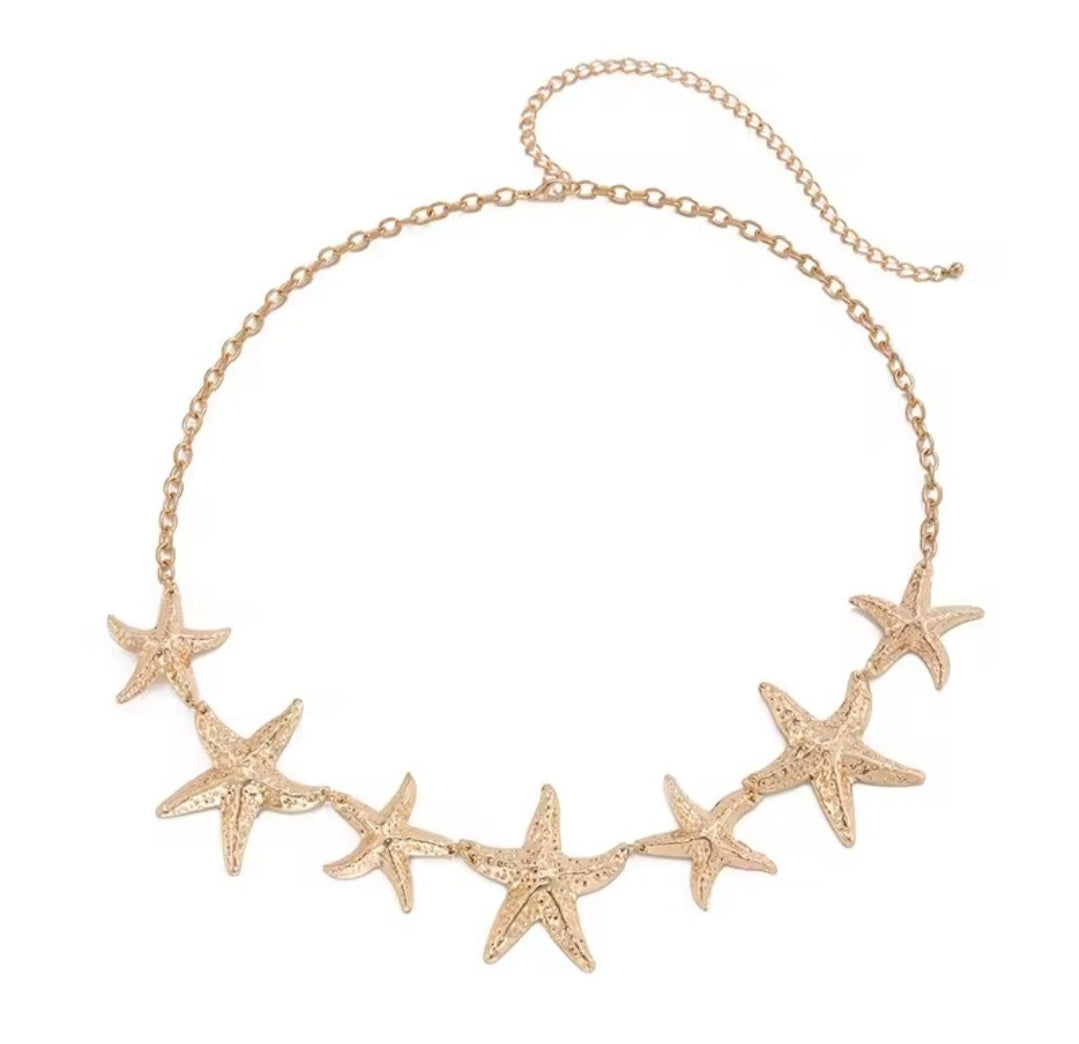 a gold-colored starfish waist chain
