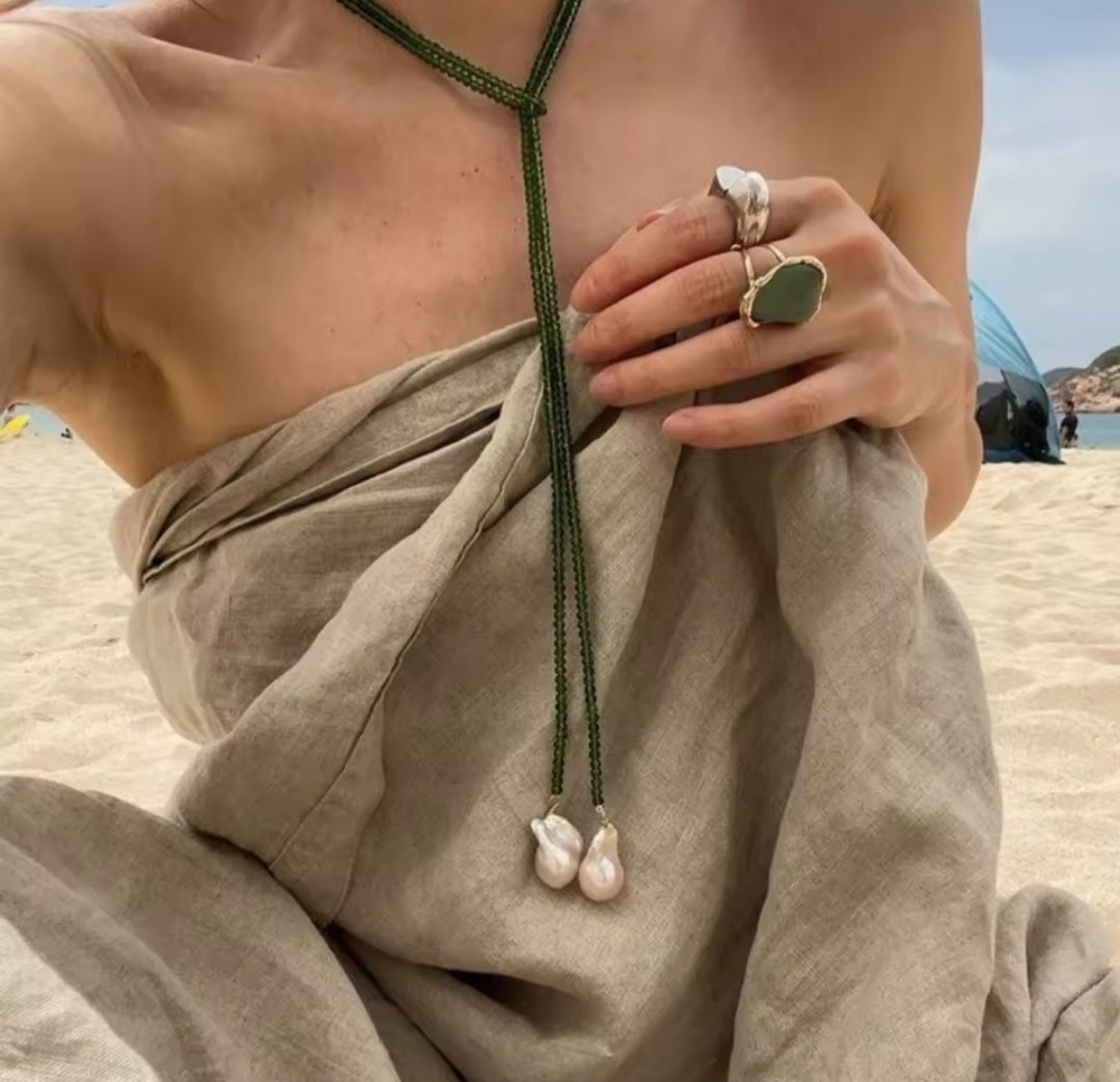 This vintage irregular baroque pearl necklace, specifically the model identified as XL1095-G, features a green beaded chain with drop-shaped