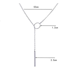This product appears to be a minimal gold-plated lariat necklace featuring a circle and a vertical bar 