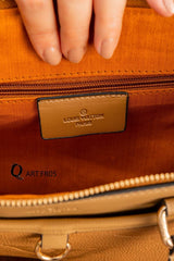 Louis Vuitton Trianon MM bag in black Monogram Empreinte leather.