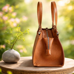 a David Jones brown top-handle handbag, likely made of PU leather.