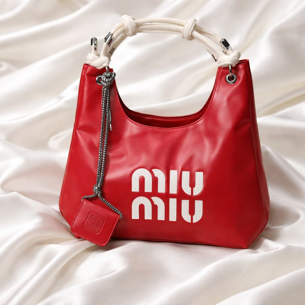 red Miu Miu hobo bag with a matching micro bag charm.