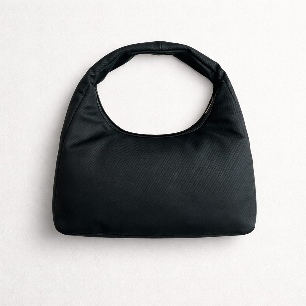 Saint Laurent Calypso mini hobo bag in black plunged lambskin leather with a gold-tone logo