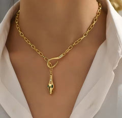 This is a gold-plated snake pendant necklace with green eyes. 