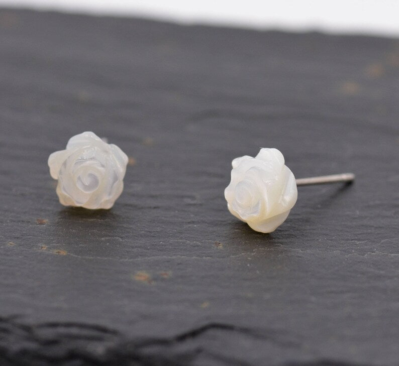 Silver Luna offers these Resin Rose Flower Stud Earrings featuring a detailed white rose design.