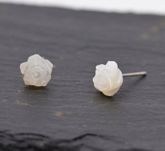 Silver Luna offers these Resin Rose Flower Stud Earrings featuring a detailed white rose design.